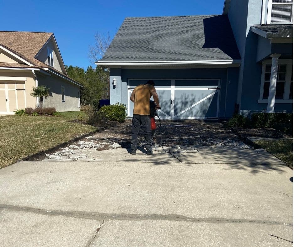 Driveway Repair - Breaking up a Cracked Driveway with a Jackhammer in St. Nicholas, FL